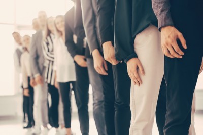 close up. image of young business people standing in a long queue